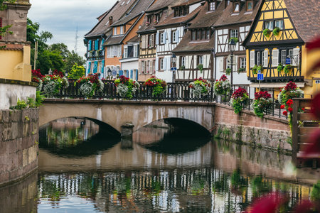 France, Colmar - July 26, 2017. Old-time residential buildings along the canal in the French city of Colmar in the province of Alsace. Medieval buildings in perfect conditionのeditorial素材