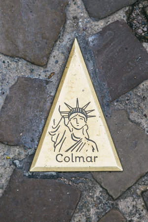 France, Colmar - July 26, 2017. The emblem of the city of Colmar on paving stones in the province of Alsace.のeditorial素材