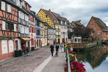 France, Colmar - July 26, 2017. Old-time residential buildings along the canal in the French city of Colmar in the province of Alsace. Medieval buildings in perfect conditionのeditorial素材