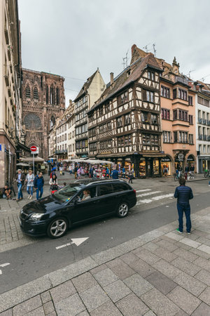 Strasbourg, France - July 26, 2017. Tourists walk along the street of Strasbourg near the cathedralのeditorial素材