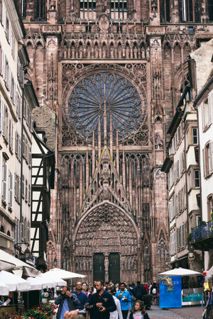 Strasbourg, France - July 26, 2017. Tourists walk along the street of Strasbourg near the cathedralのeditorial素材