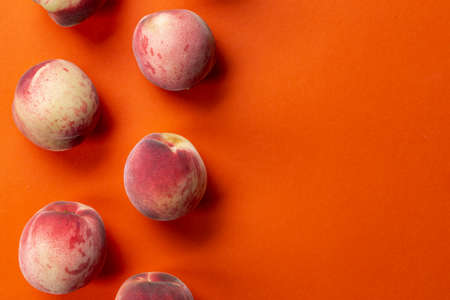 Flat lay composition with ripe peaches on color background. Top viewの写真素材