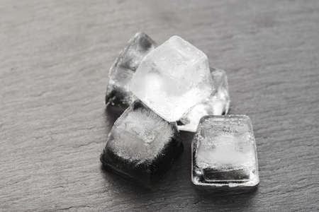 ice cubes on a black background. place for text. beverage cooler