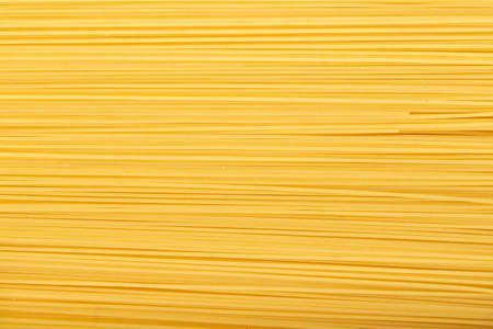 raw spaghetti as a background. place for text. traditional italian foodの写真素材