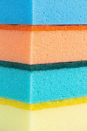 many colored washcloths are lined with a column. place for text