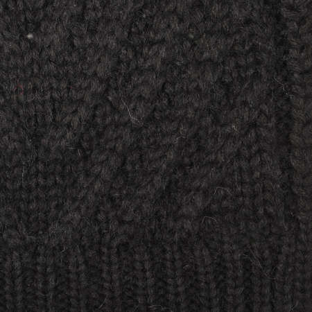 knitted warm background, element of a sweater or scarf. the texture of knitting and yarn is clearly visibleの写真素材