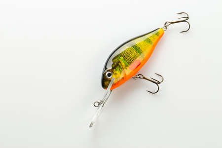 Ukraine, Kiev - March 10, 2020. Fishing bait tackle and baubles for fishing on a white background, wobbler.の写真素材
