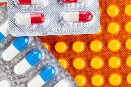 Colorful of tablets and capsules pill in blister packaging. Pharmaceutical industry concept....