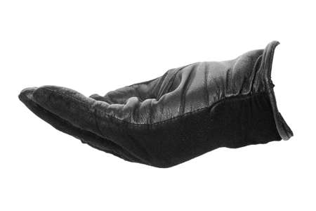 hand in a black leather glove turned palm up. isolated on white backgroundの写真素材