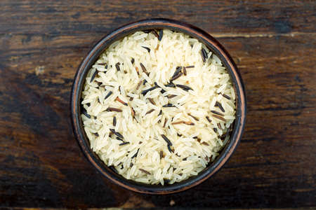 brown rice in a plate. assorted rice - white and brown. traditional chinese and japanese foodの写真素材
