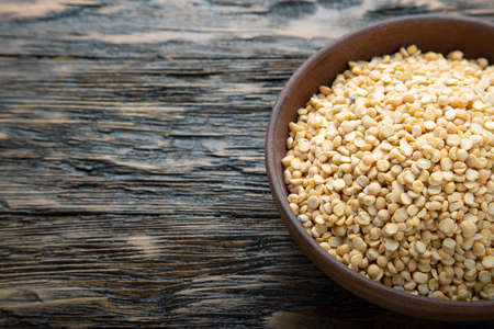 Dried yellow peas in a plate. Products for cooking delicious food.
