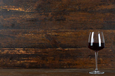 Glass of red wine on the bar.の写真素材