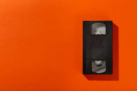 Videotape without a cover on an orange background. Top view.の写真素材