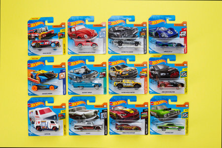 Ukraine, Kyiv - February 28.2020: The group of colorful toy car collection on yellow background. Hot...