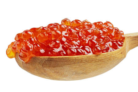 Red Caviar in a wood spoon. Delicatessen. Gourmet food. Texture of caviar. Seafood.の写真素材