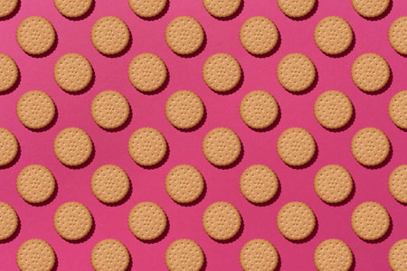 Sweet cookies flat lay pattern on light pink background. Top view.の写真素材