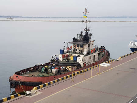 Towing ship moored in the port. Commercial port, Delivery.の写真素材