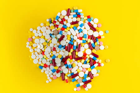 Many colorful medicines and pills from above. Medical concept. Concept of threat of various diseases. Space for text.の写真素材