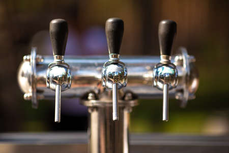 Silver Cranes for bottling beer or wine on open air. The concept of outdoor recreation, picnic, corporate.の写真素材