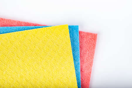Clean sponge cloths on white background. Household cleaning cloth. Cleanliness concept. Space for...