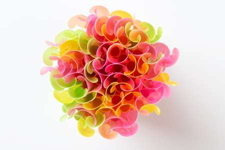 Colorful drink straws on white background. Colored tubules for juice and cocktails. Top view.