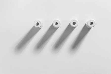 AA size alkaline batteries on a white background. Several batteries in a row. Space for text. Accumulator.の写真素材