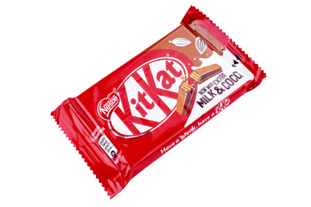 Ukraine, Kyiv - December 12.2021: Kit Kat chocolate bar on white background. Bars Kit Kat is...