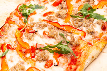 Delicious pizza served on wooden plate. Concept for advertising flyer and poster for restaurants or pizzerias, template with delicious taste of pepperoni. Banner.の写真素材