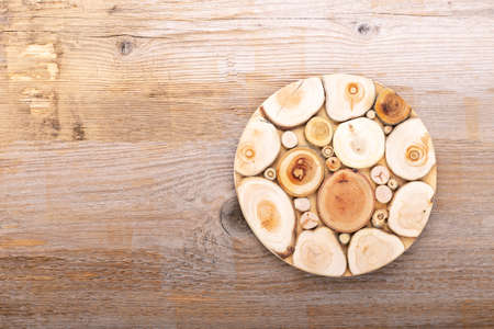 Empty cutting board on a wooden background. Top view. Space for text.の写真素材