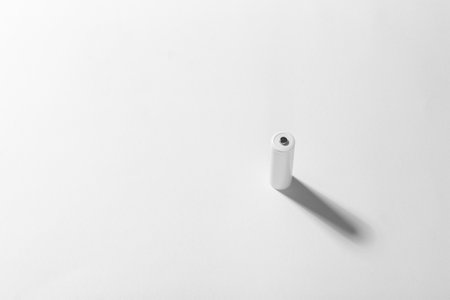 AA size alkaline battery on a white background. Accumulator. Space for text.の写真素材