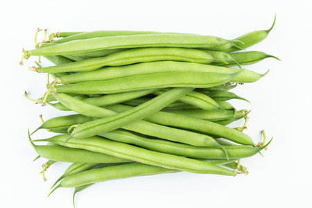 Bundle of fresh green beans on white background. Space for text.Top view.