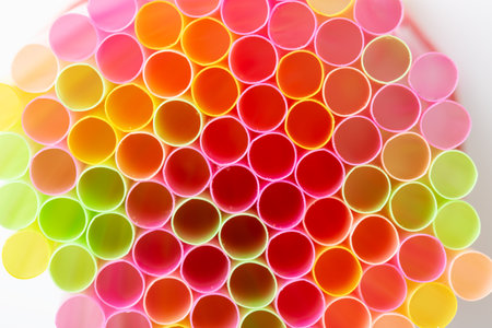 Multi-colored plastic straws isolated on a white background. The file contains a clipping path. View from aboveの写真素材