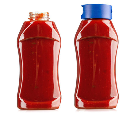 Two plastic bottles with ketchup, open and closed. Traditional tomato sauce for meat. Isolated on white background. File contains clipping pathの写真素材
