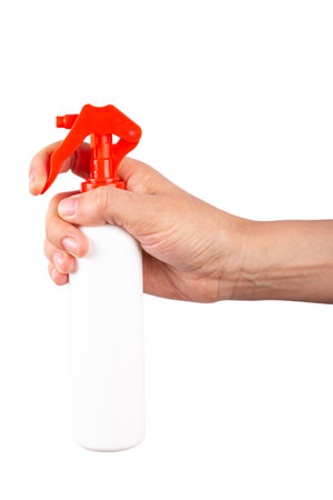 Woman holding bottle of cleaning product on isolated white background. Cleaning concept. File contains clipping path.の写真素材