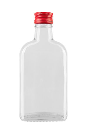 Empty glass bottle with a red cap from a medicine or an alcoholic drink of vodka, whiskey isolated on a white background. File contains clipping path. Full depth of field.の写真素材