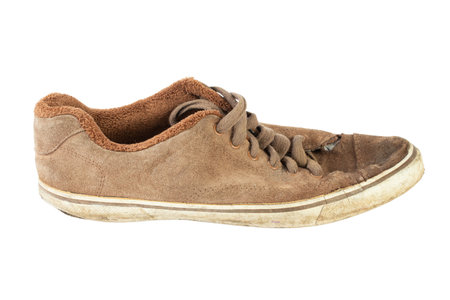 Old dirty brown sneakers, isolated on white background. The file contains a clipping path.の写真素材