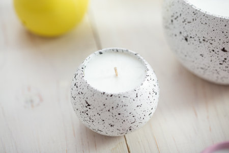 Many different candles on a white table. Decor, home comfort, romantic mood.の写真素材
