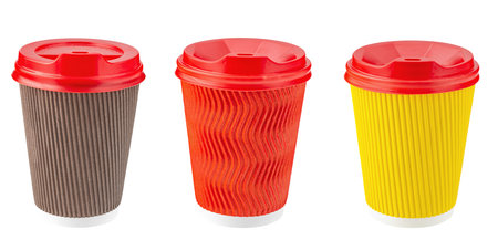 Set of paper disposable cups of different colors for coffee, tea and other hot drinks isolated in white. Disposable tableware. File contains clipping path.の写真素材