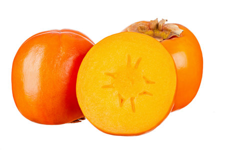Persimmon fruit with cut in half isolated on white background. File contains clipping path. Full depth of field.の写真素材