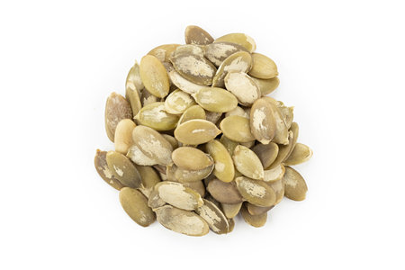 Bunch of pumpkin seeds on white background. Top view.の写真素材