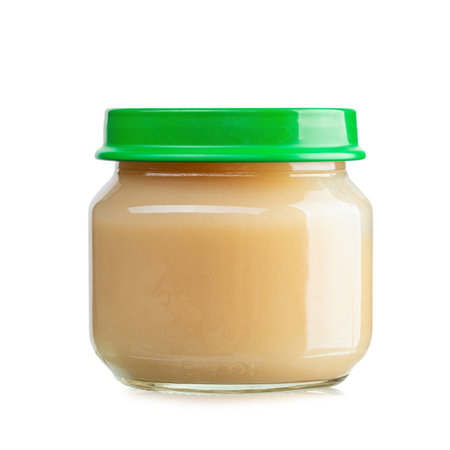 Jar with yummy baby food isolated on white background. Baby puree. File contains clipping path.の写真素材