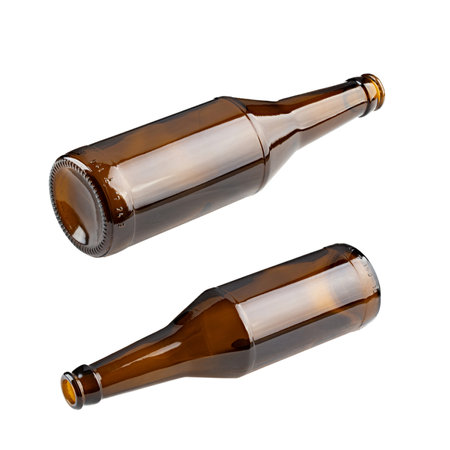 Empty beer bottle made of brown glass, isolated on white background.の写真素材