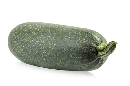Fresh whole zucchini isolated on white background close up.の写真素材