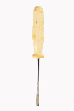 Yellow flat head screwdriver isolated on white background.の写真素材