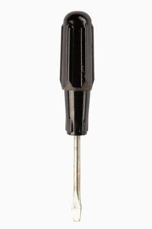 Black flat head screwdriver isolated on white background.の写真素材