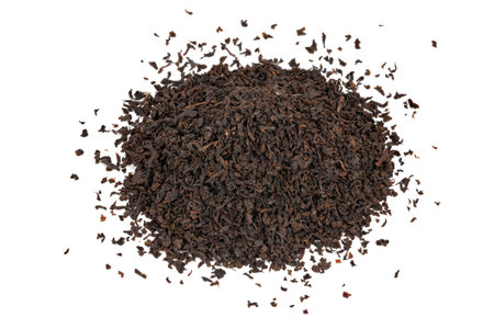 Dry black tea leaves isolated on white background. Black Ceylon tea. Top view.の写真素材