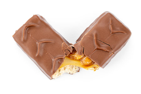 Ð¡hocolate bar. Two halves of a chocolate bar stuffed isolated on a white background. Sliced crunchy chocolate sweet bar.の写真素材