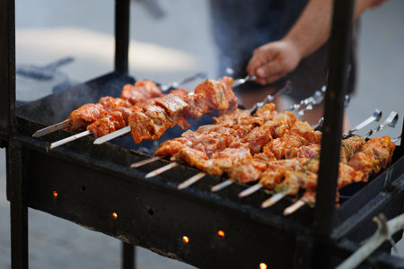 Bar-BQ or BBQ with kebab cooking. Charcoal grill of meat skewers. Barbecue dinnerの写真素材