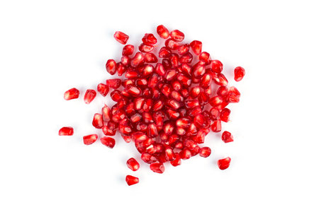 Heap of pomegranate seeds on white background. Top view.の写真素材