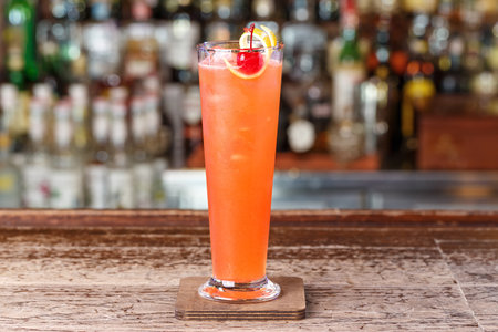 Strawberry club cocktail on the basis of gin, decorated with cherries and lemon zest. Space for text designの写真素材